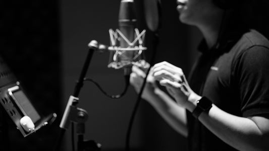Man using vocal effects singing in front of microphone