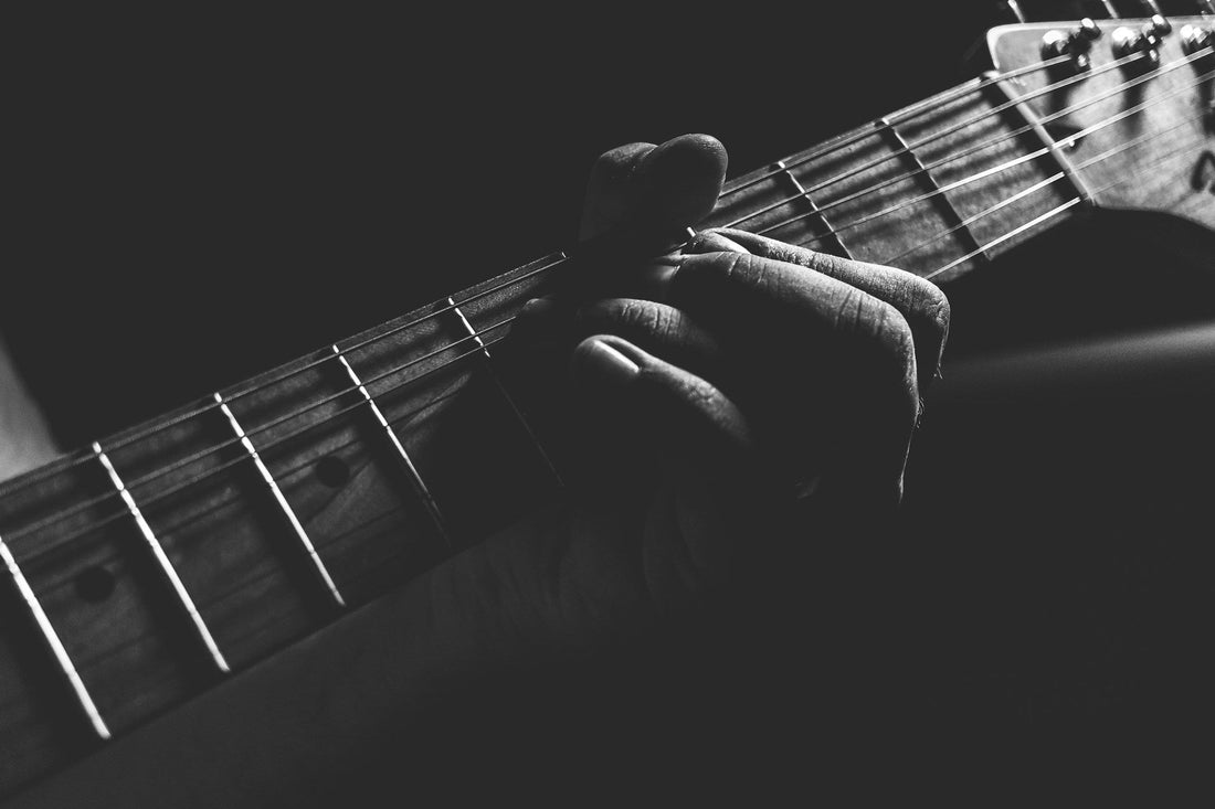 Hands on a guitar
