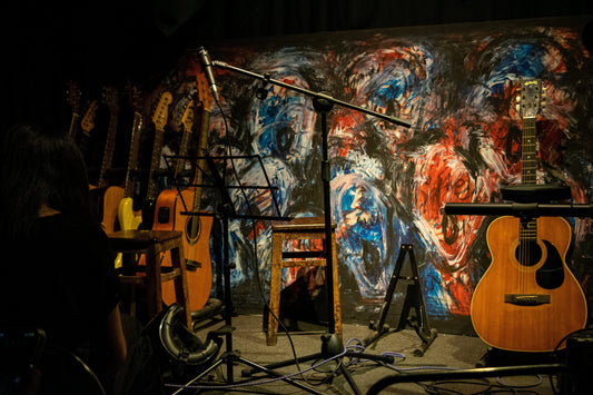 Wall with microphone and guitar on it