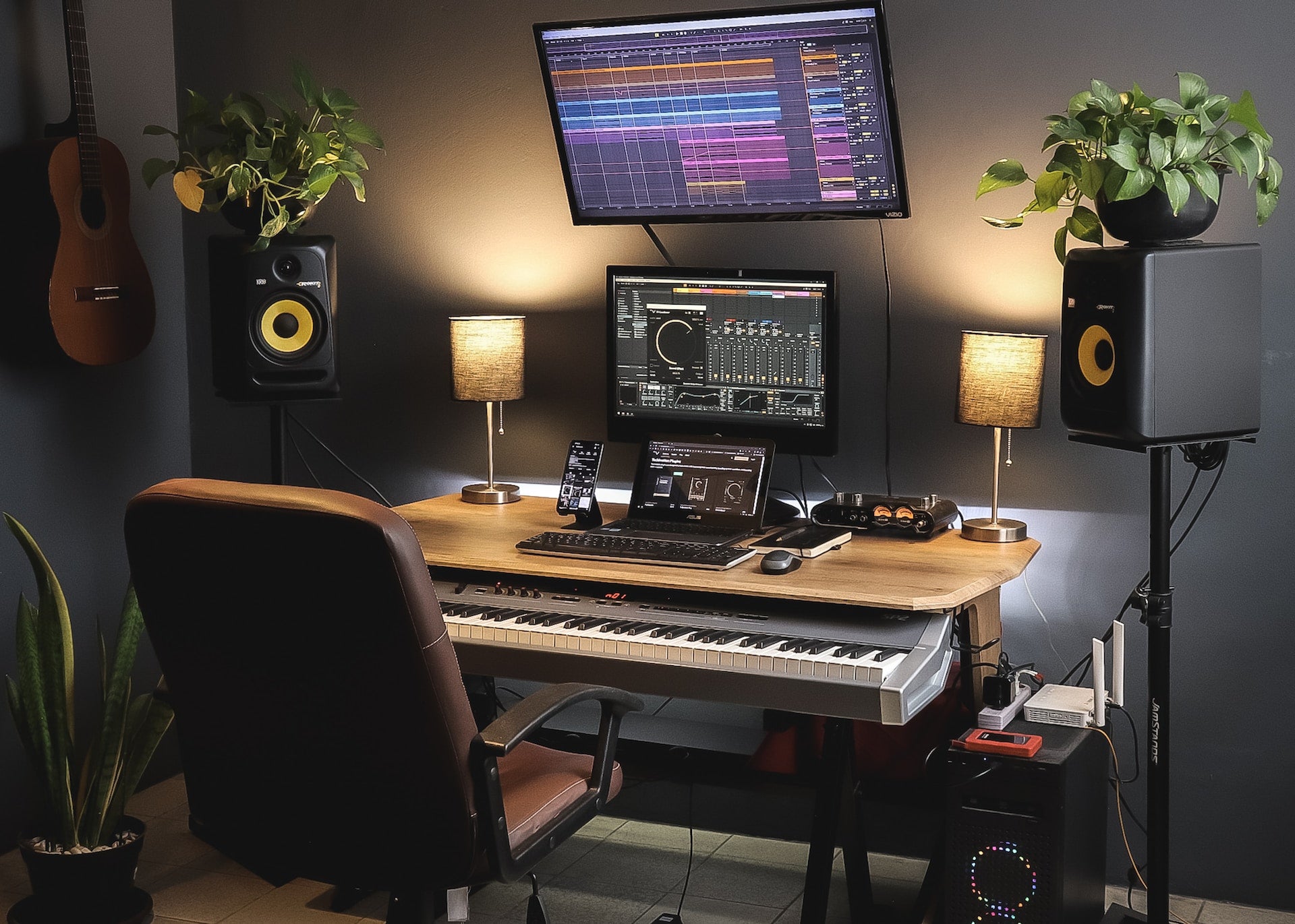 Small home studio with Pro Tools on both the laptop and monitors