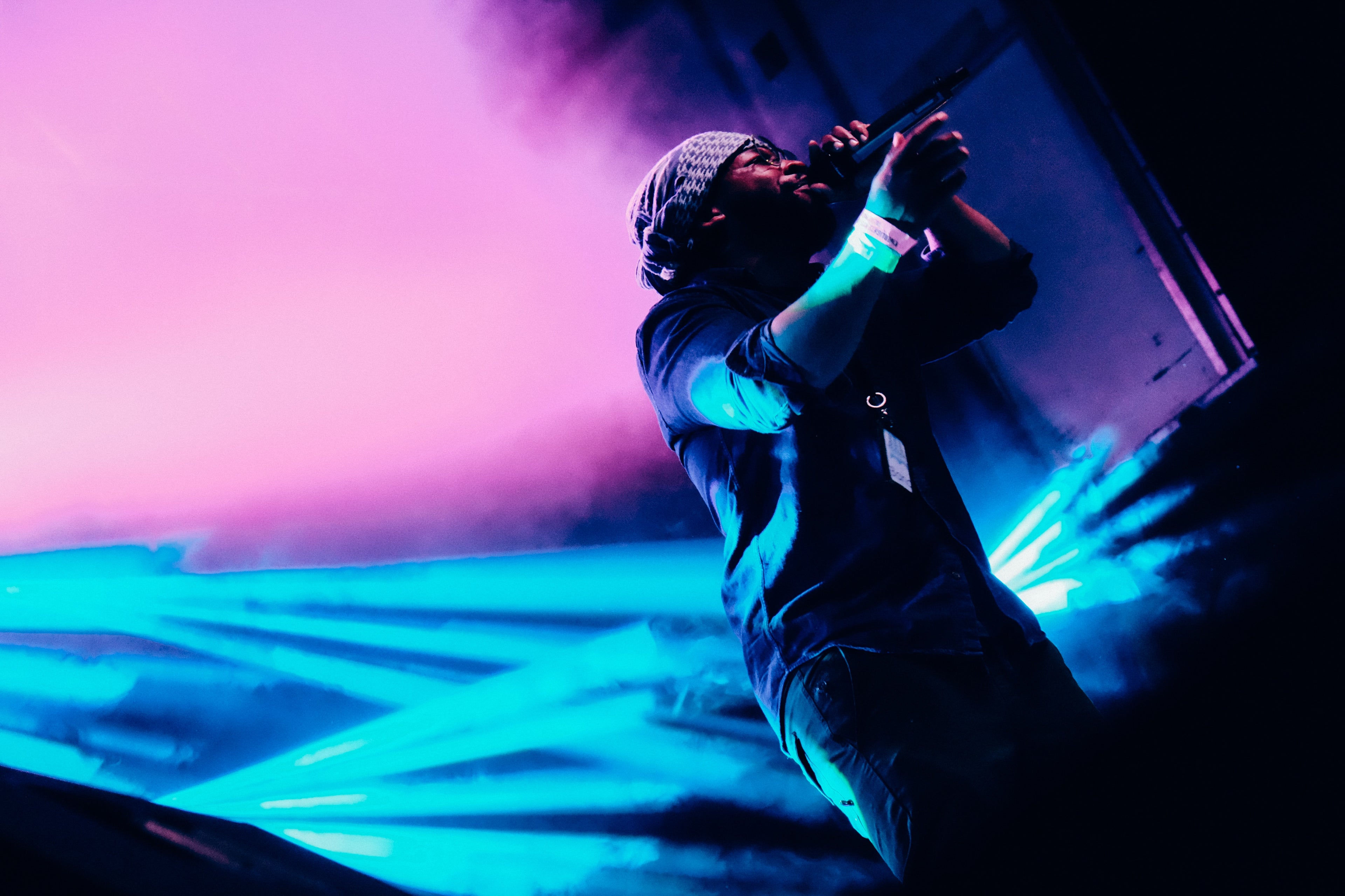 Man singing with mic on stage